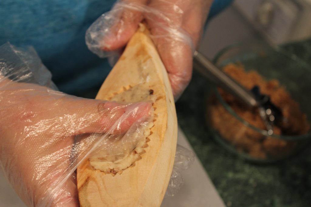 Filling the Molds with cookie dough.