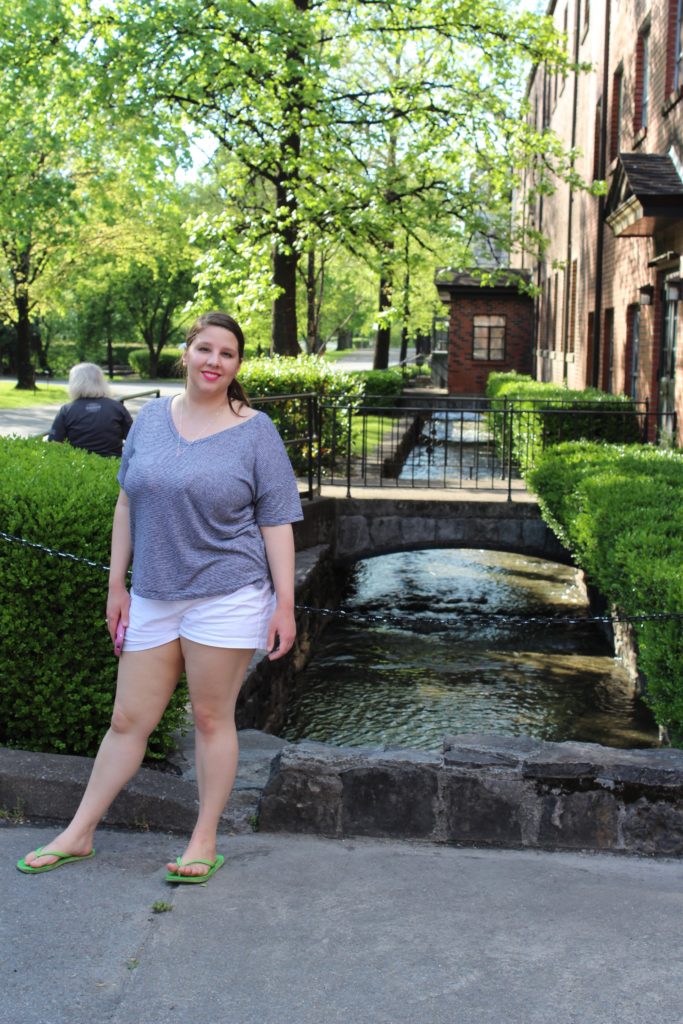 My beautiful daughter beside the flowing spring water.