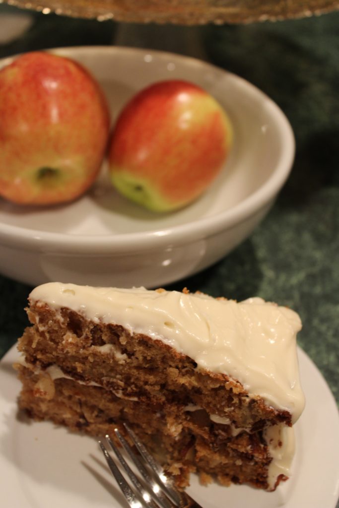Slice of Caramel Cream Cheese Frosted Apple Cake