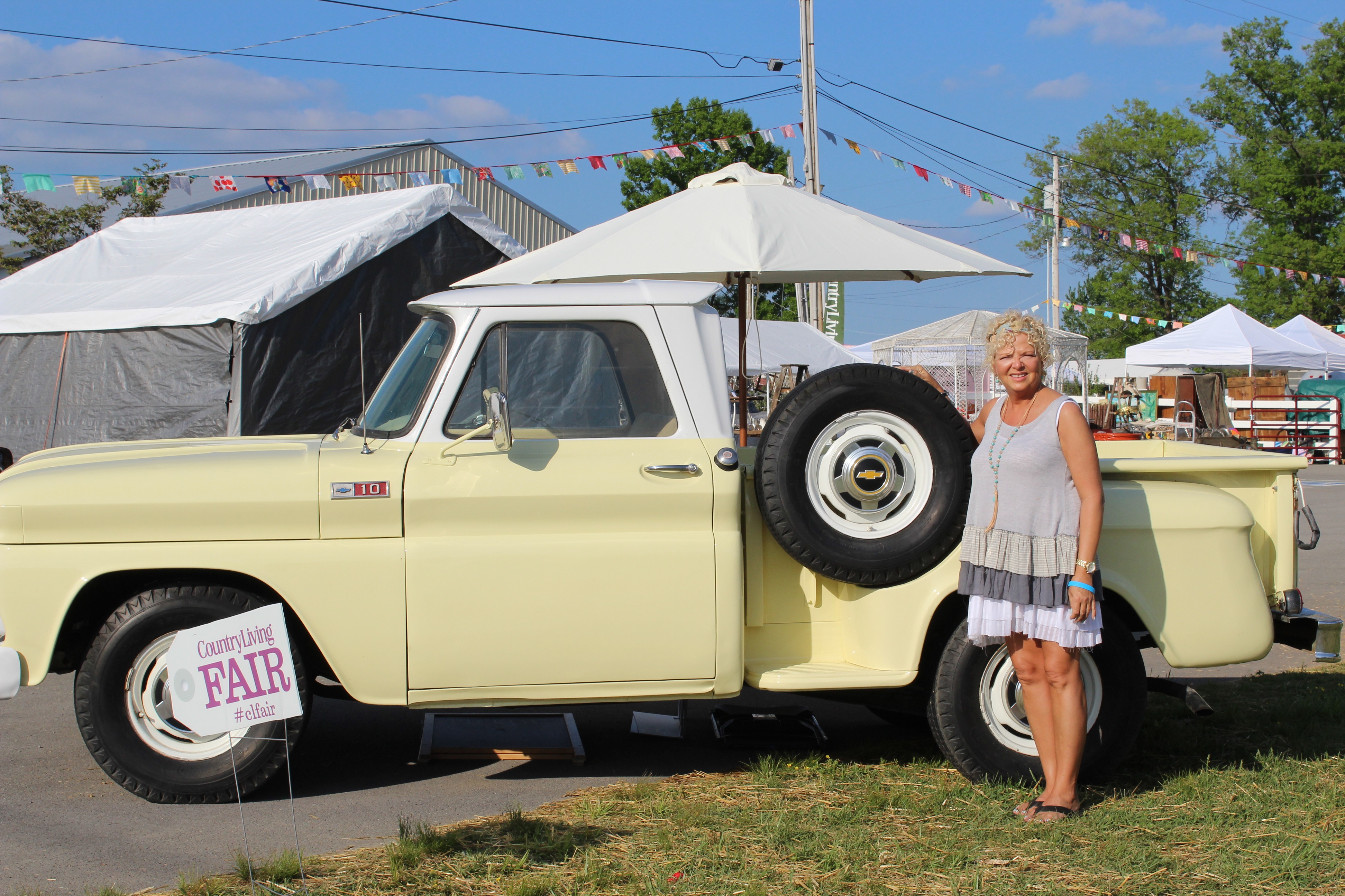 Country Living 2016 My beautiful sister, Kim in front of an antique pickup truck.